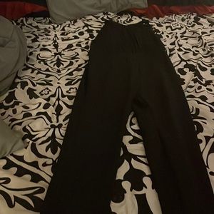 I am sell a black sleeveless jumpsuit size large this item used one time.